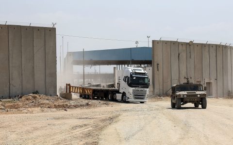 --PHOTO TAKEN DURING A TOUR ORGANISED BY THE ISRAELI MILITARY--
An Israeli army vehicle leads a truck in Beit Hanun in the northern Gaza Strip during an operation of humanitarian aid delivered from Jordan to the Palestinian territory through the Israeli controlled Erez terminal, on May 1, 2024, amid the ongoing conflict between Israel and the Palestinian militant group Hamas. - Israel, under pressure from US President Joe Biden, said in early April that it would allow aid deliveries through the Erez crossing into northern Gaza and allow docking at the Ashdod port just north of the blockaded territory. The US secretary of state on April 30, toured a loading zone for the relief goods on the outskirts of Amman before flying to Israel. (Photo by JACK GUEZ / AFP)